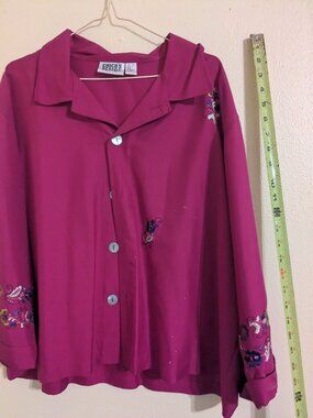 Fuscia top or jacket.